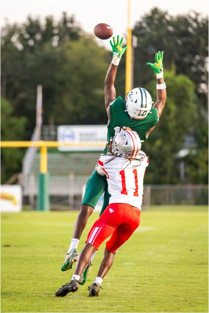 Archbishop Shaw Eagles football player Baylon Jackson, wide receiver jumping to catch a pass.