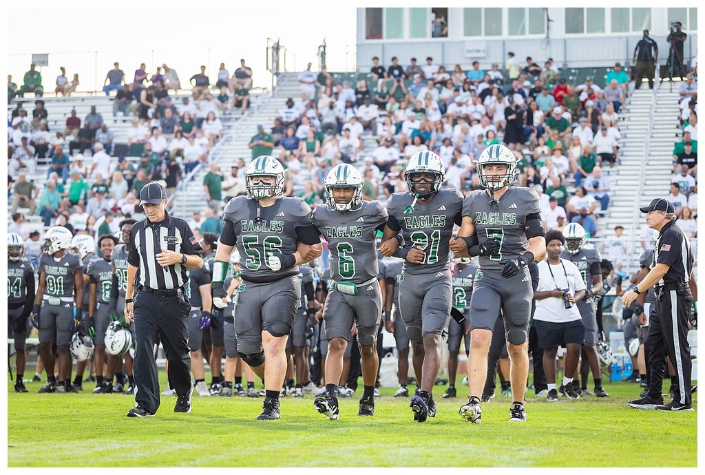 Shaw Eagles Seniors Craig Bourgeois Jr (56), Allen Shaw, III (6), Rontrae Carter (21), Ethan Lentz (7) walk arm in arm to the coin toss.